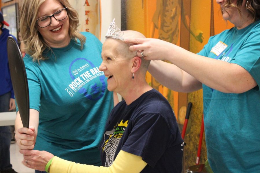 Nancy Shea, the West Campus Attendance Office Receptionist, gets a new look during  the staff shave on March 22. Photo courteous of Yearbook