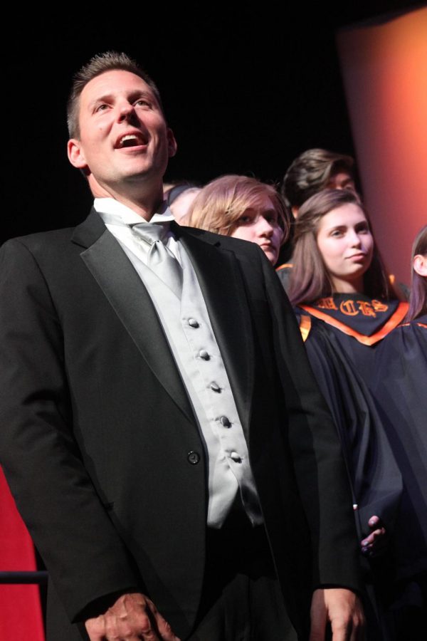 Galvicius addressing the crowd at the MCHS Vocal Warriors winter concert.