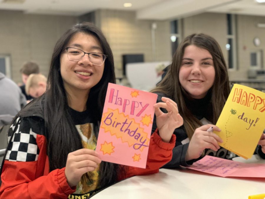 Eileen Zheng and Breanna Darcy help put together birthday blessing boxes for the homeless during a November Key Club meeting in the West Cafeteria. Key Club students will hand out the boxes to homeless on their birthdays throughout the year.
