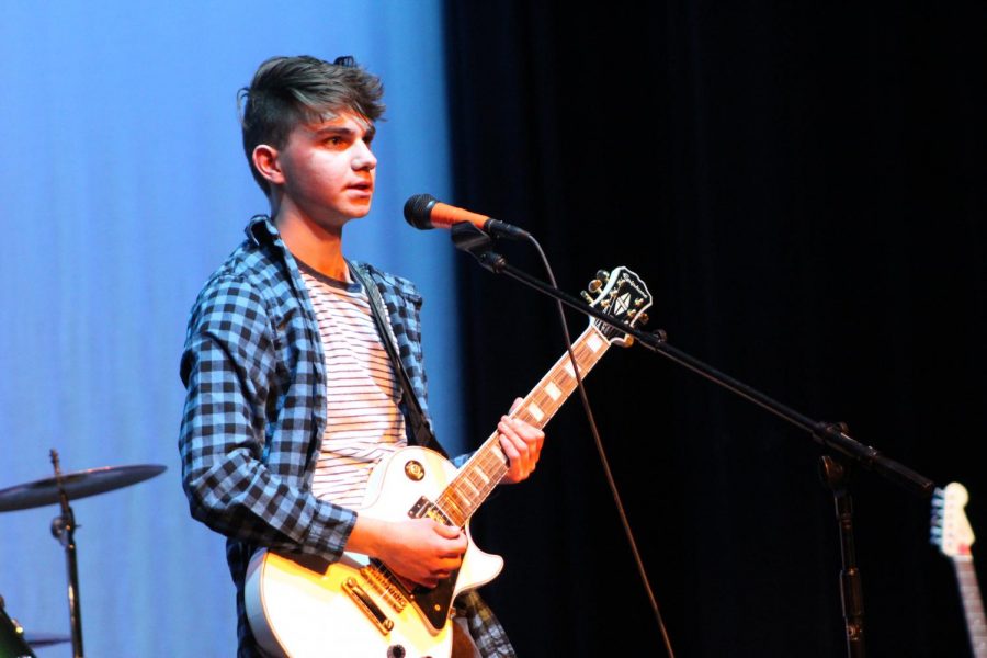 Joe Cangelosi plays guitar for Winter Tennis during the Battle of the Bands. On January 24, MCHS student-formed bands competed for the title of 2020 Battle of the Bands champion.