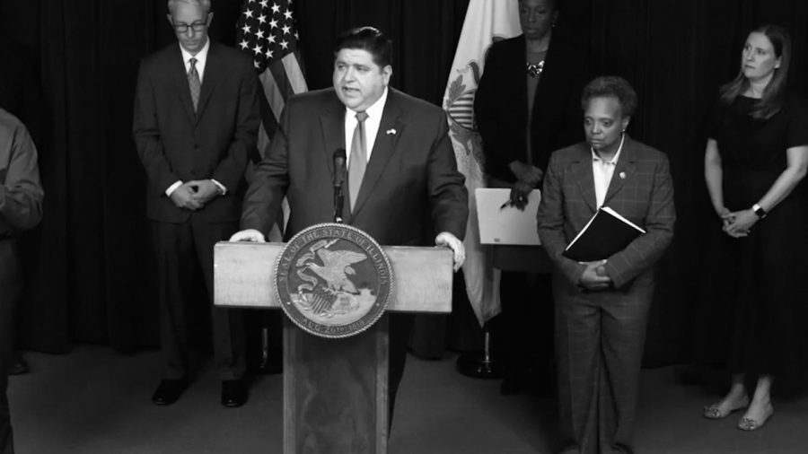 With Chicago mayor Laurie Lightfoot at his side, Governor J.B. Pritzker issues a directive to all Illinois residents to stay at home during a Friday press conference.