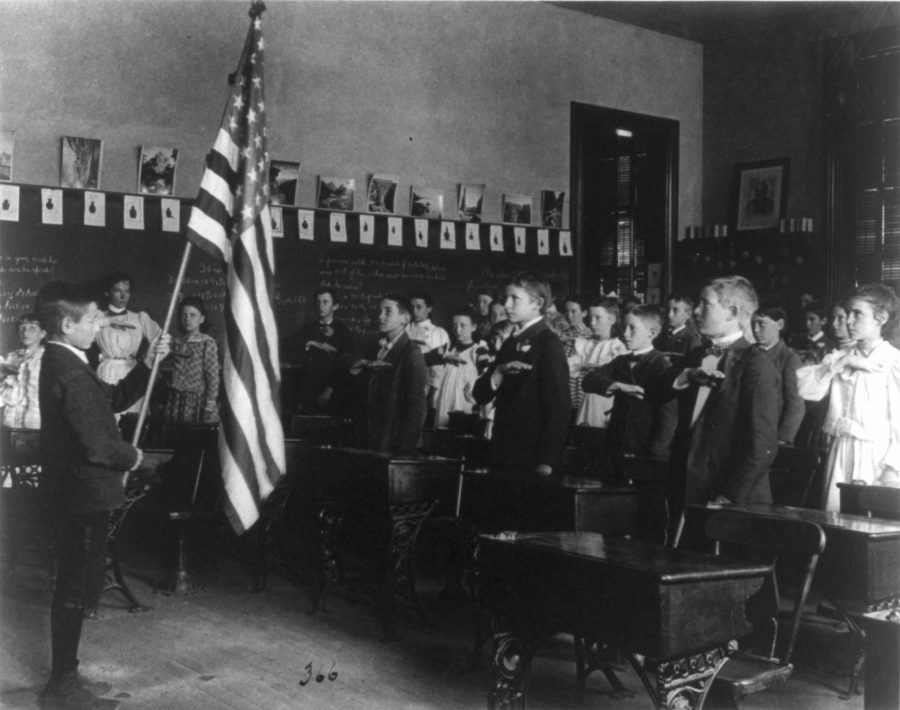 Students in the United States pledged their allegiance to the American flag well before 1942, when Congress formally adopted the Pledge—even as early as 1899, as in this image. In more modern times, students question whether the Pledge should be a required part of their day.