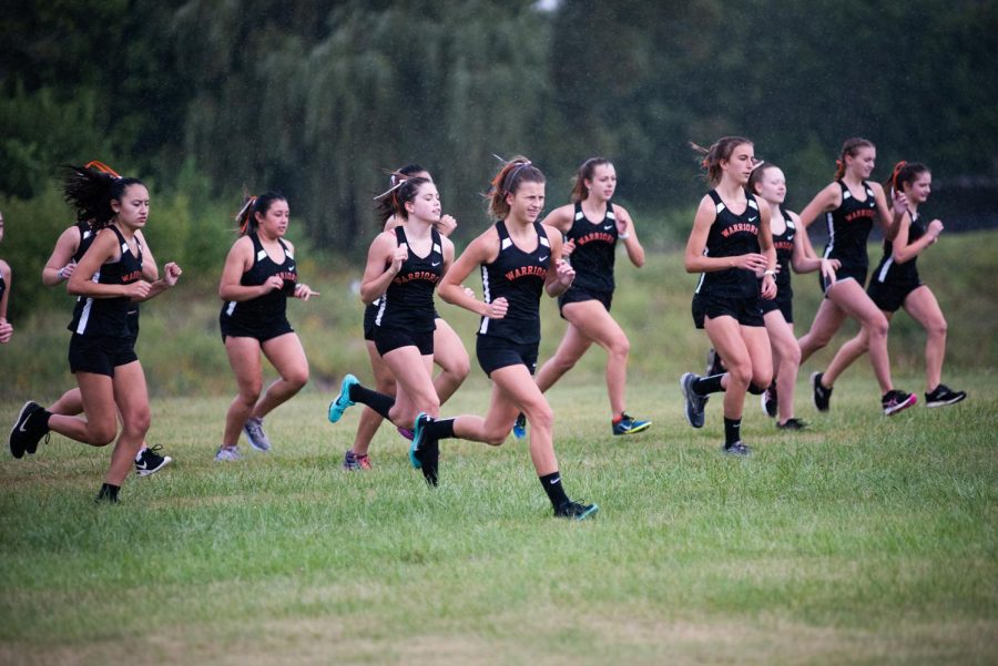 The girls cross country team competes in a race against Dundee-Crown on September 10 at West Campus.