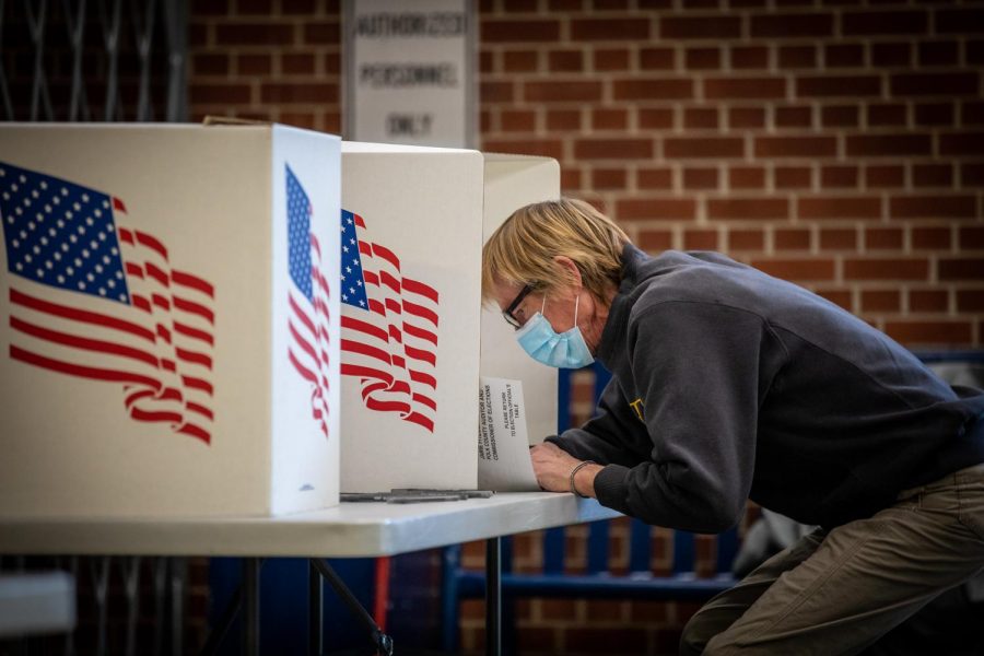 Voters in Des Moines precincts 43, 61 and 62 cast their ballots at Roosevelt High School on November 3. Poll workers around the country, including in McHenry County, helped ensure that Election Day go more smoothly than many expected.