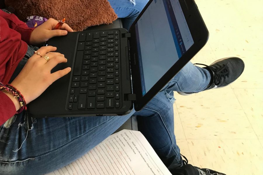 A student submits an assignment through Schoology on her Chromebook. MCHS changed their mind after announcing a new digital schedule that added ten minutes to each class to support struggling students.