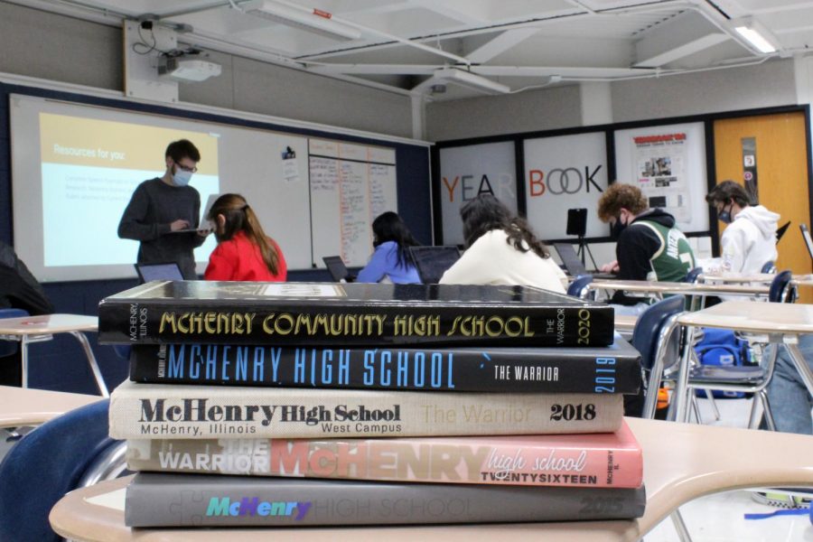 A stack of MCHS yearbooks sit in Mitch Stengels classroom while he teaches on February 2. Though it was only his first year as advisor, Stengel helped his team create a third place yearbook even during a pandemic.