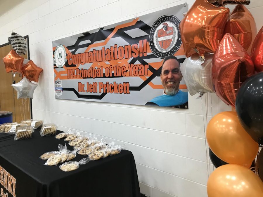 A table full of treats and gym full of family and friends surprised Illinois Principal of the Year Dr. Jeff Prickett during a special award ceremony in the Easy Main Gym on March 18.