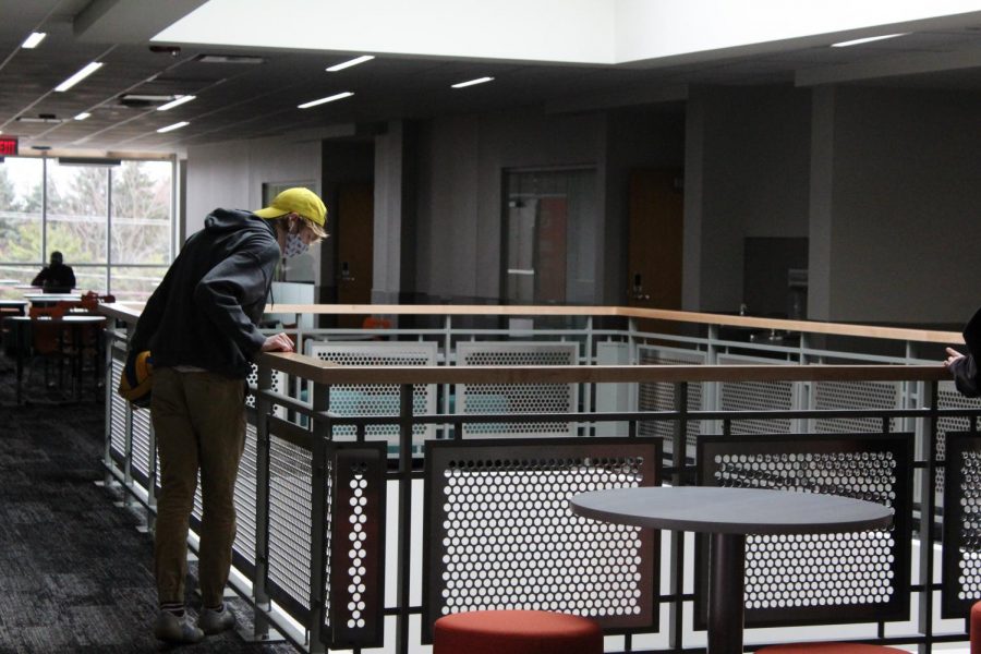 A student looks from the fourth floor to the third floor of the new extension at West Campus on March 22. Called the Center for Science, Technology and Industry, the space accommodates math, science, CTE, and communications classes.
