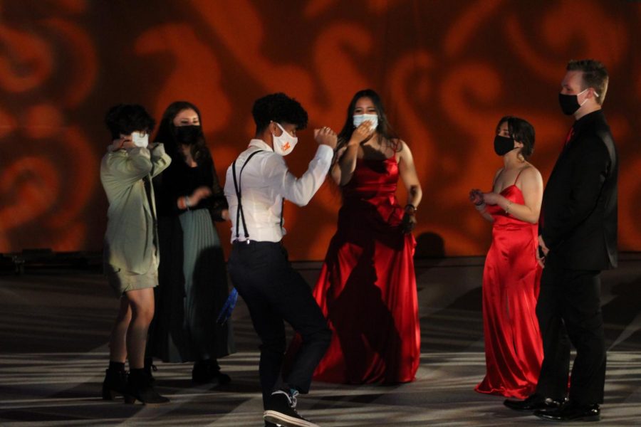 Upper classmen can be seen dancing their hearts out at the 2021 Mask-erade event in the West campus main gym. 