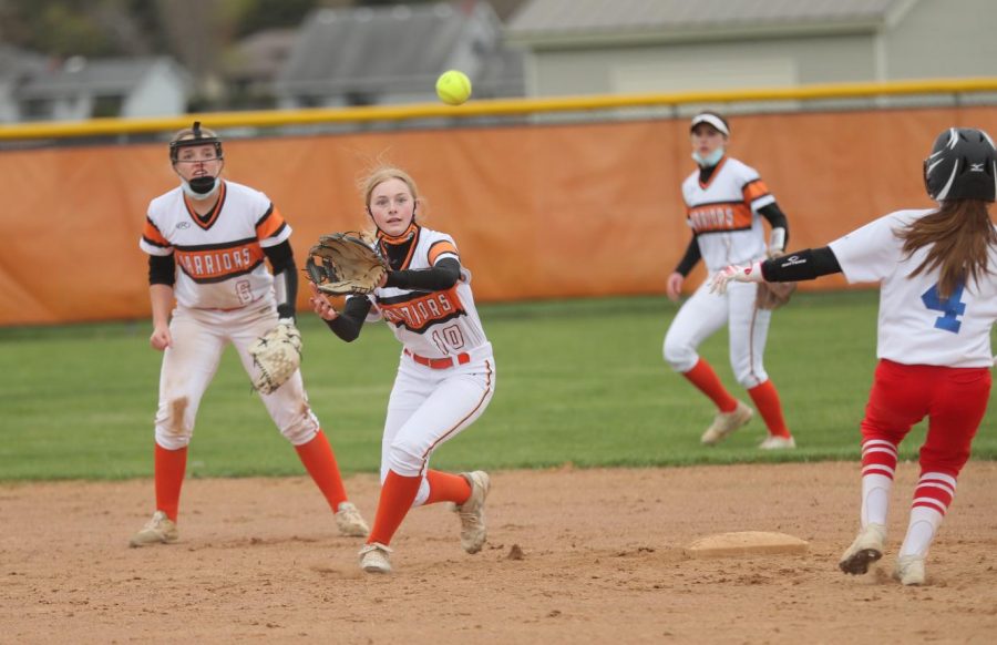 Morgan Sellek catches a throw at second base during a varsity softball game at West Campus on April 14. Softball players are among those who are allowed to play without masks, according to guidance from the IHSA.