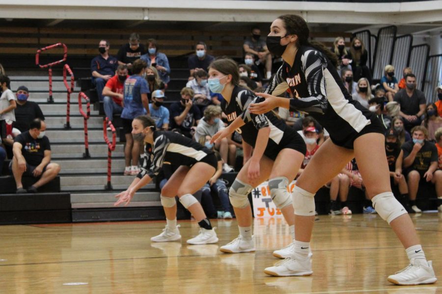 The JV volleyball team competes against Dundee-Grown during a match on September 9 in the Freshman Campus main gym.