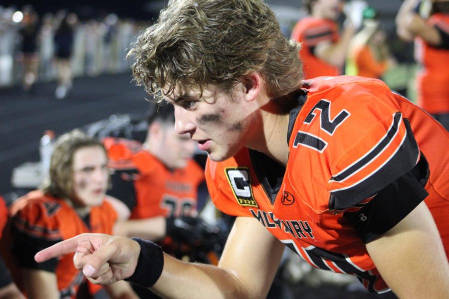 Andrew Hoffman talks with teammates during the Homecoming football game against Dundee-Crown.