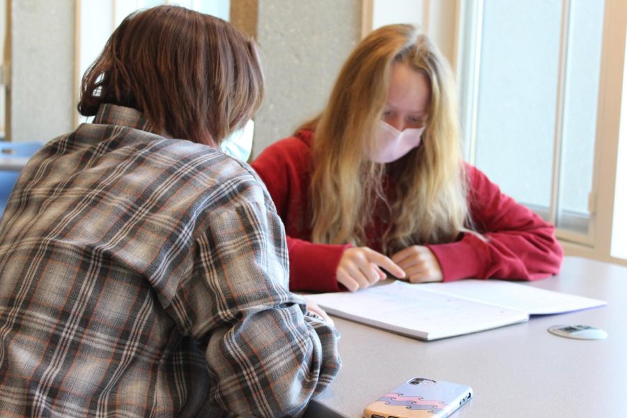 Nicole Pedretti helps a student catch up on her work during Learning Forward on  October 27 in the Upper Campus library. 