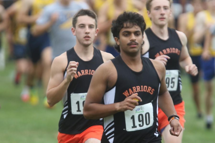 Cross country runners Rayaan Ahmed and Joe Hissem push toward the finish line during a meet at Veteran Acres in Crystal Lake, IL on September 4.