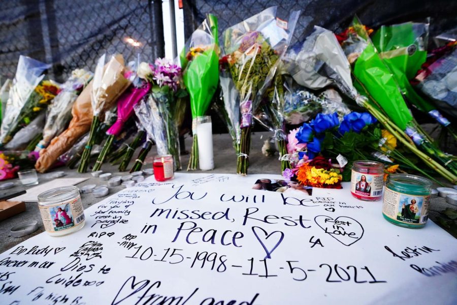 Candles, flowers and letters are placed at a memorial outside of the canceled Astroworld festival at NRG Park on Nov. 7 in Houston.