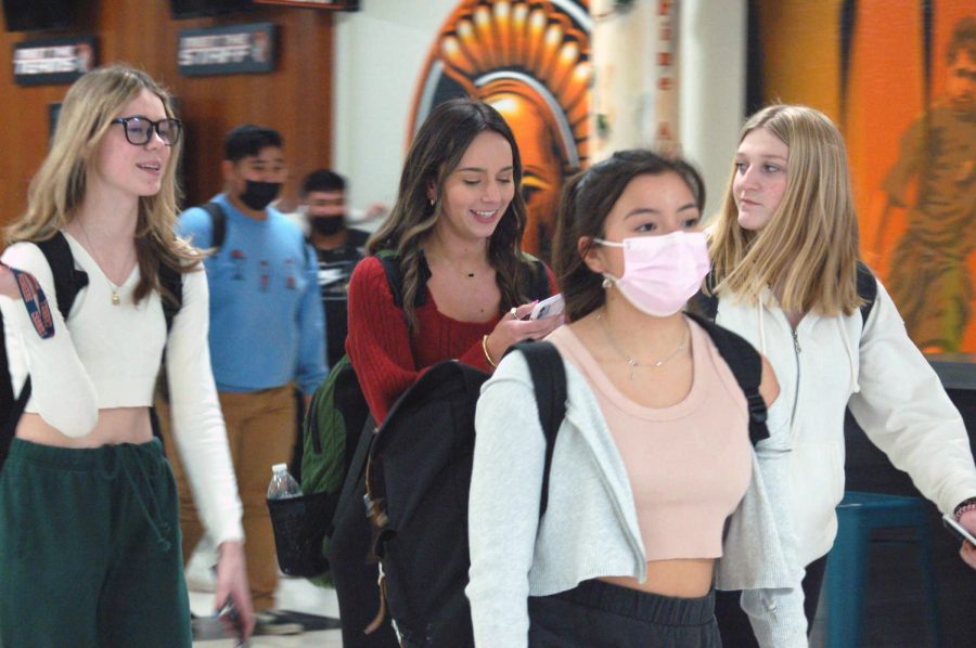 Students leave the Upper Campus after school on Friday, some donning masks and some without. Masks have been optional at MCHS since the beginning of February when a state judge upheld a restraining order against Governor JB Pritzker's mask mandate in schools.