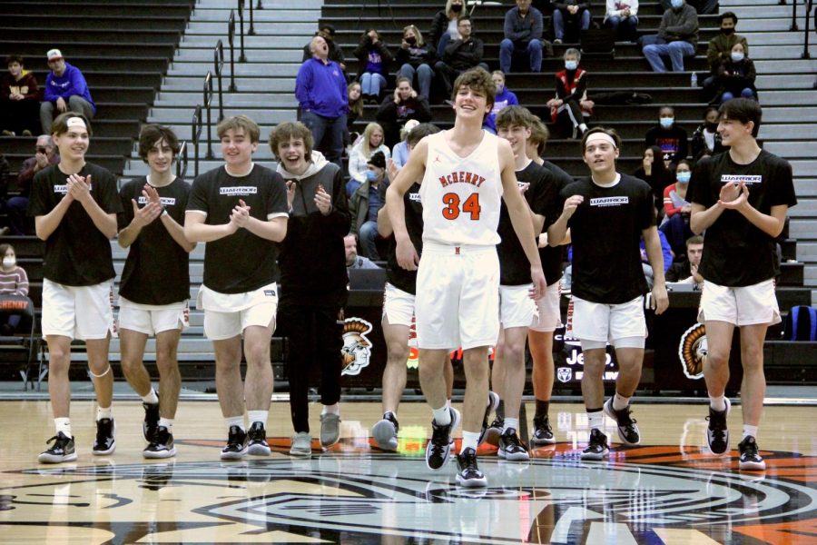 Alessandro Quirolpe is walked out by teammates during the senior night game against Dundee-Crown on Feb. 11 in the Upper Campus main gym.