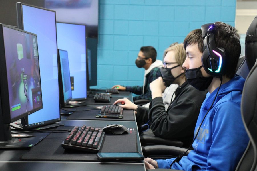 Students sit down after school to play games as a community in the E-Sports club.