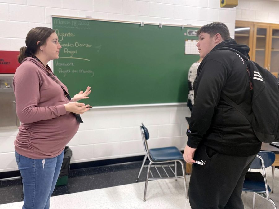 Ashley Nagel speaks to one of her freshman students during AIM on Mar. 18 in room 424 at the Freshman Campus.