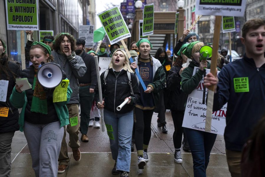 Students and activists rally outside the DePaul University Loop campus, in Chicago, on May 3, 2022, in reaction to the leaked draft decision by the Supreme Court that showed the courts intention to overturn Roe v. Wade.
