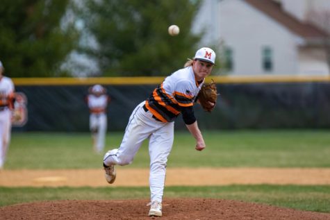 Richard Powell closes a varsity boys baseball game against Jacobs on April 14 at Peterson Park. The Warriors won 10-1.