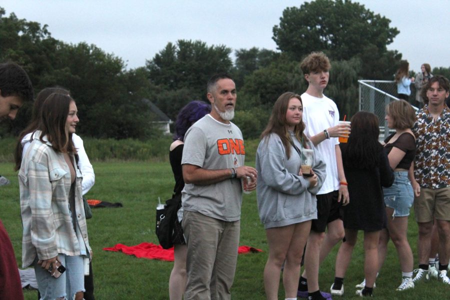 Members of the class of 2023 meet on the soccer field behind the Upper Campus at 5:30 a.m. to watch the sunrise and celebrate the start of their final year of high school.