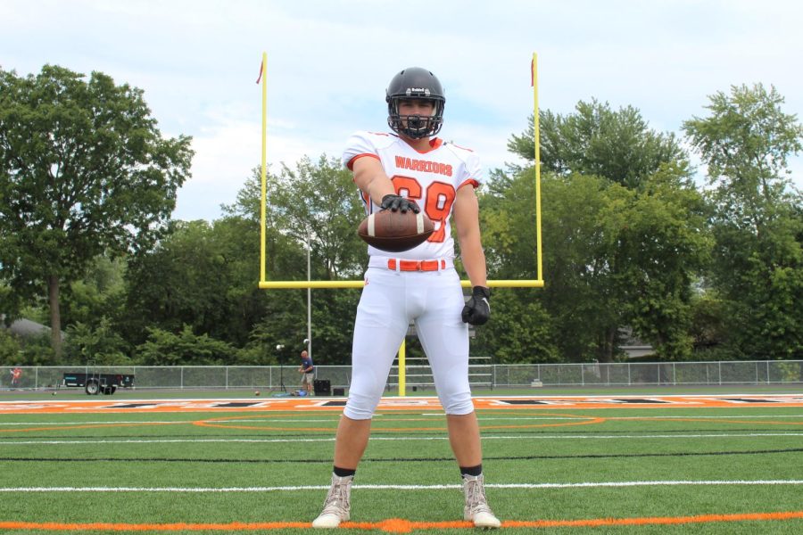 Varsity football player Max Smits poses during media day at McCracken Field on Aug. 17.