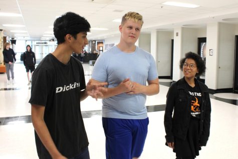 Sophomores Luis Adame, Jamison Shea and Jiji Thorne walk through the hallways of the Upper Campus. As sophomores, this is their first year in the building, which makes them feel like freshman for a second year in a row.
