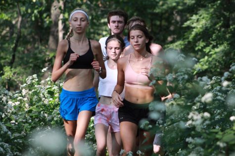 Runners from the cross country team practice at Veteran Acres in Crystal Lake on September 15.