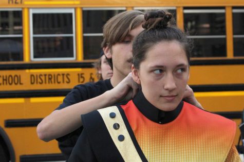 Members of MCHSs Marching Warriors prepare for Chicagos 70th Columbus Day Parade on Oct. 10. The band took a bus downtown, gathered on Upper Wacker Dr. and marched down State St. 