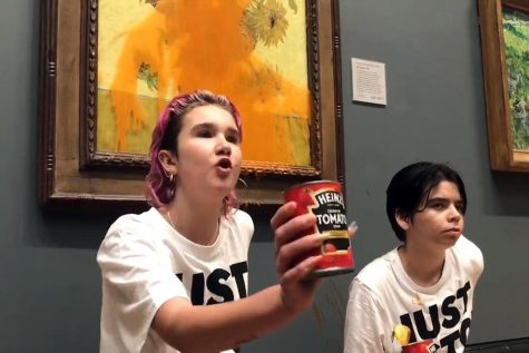 Just Stop Oil protesters glued themselves to the wall and then threw tomato soup at Vincent Van Goghs iconic 1888-9 art work Sunflowers, at the National Gallery on Oct. 14, 2022, in London.