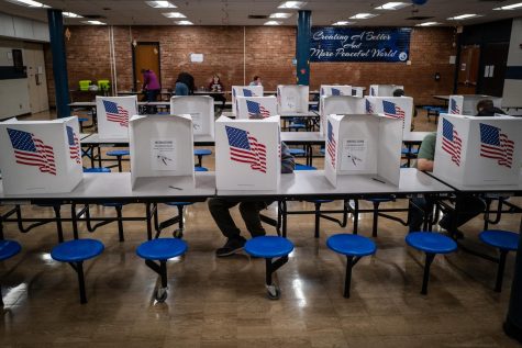 Voters cast their election on Nov. 8 in a school cafeteria in Des Moines. In McHenry County, officials judged the midterm election to be conducted freely and fairly.