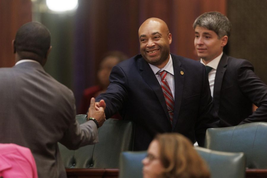 State+Rep.+Justin+Slaughter+celebrates+after+the+chamber+passed+changes+to+the+controversial+criminal+justice+law+known+as+the+SAFE-T+Act+at+the+Illinois+Capitol+building+on+Dec.+1.
