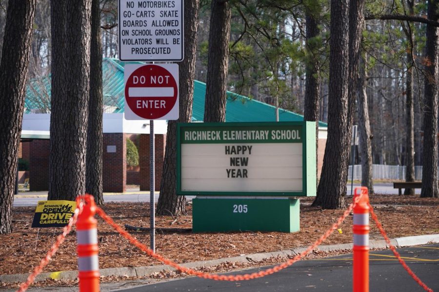 A school sign wishing students a Happy New Year is seen outside Richneck Elementary School on Saturday, Jan. 7, 2023, in Newport News, Virginia. A 6-year-old student was taken into custody after reportedly shooting a teacher during an altercation in a classroom at Richneck Elementary School on Friday. 