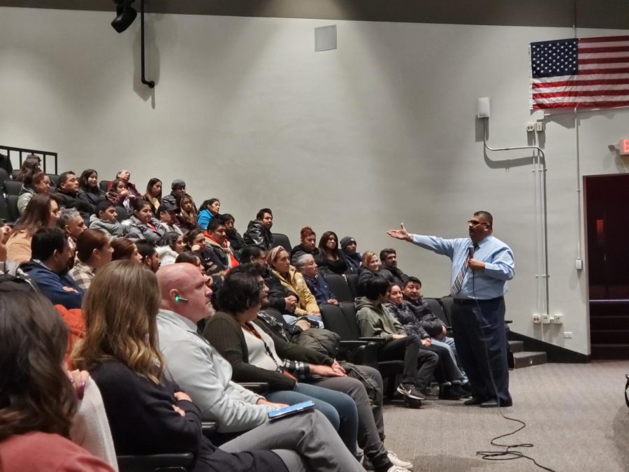 Speaker Dr. Ferney Ramirez Hernandez talks to Spanish-speaking families during a special presentation about how to improve family relationships at the Upper Campus auditorium on Jan. 31. 