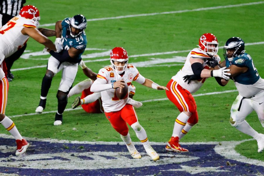 Kansas City Chiefs quarterback Patrick Mahomes scrambles for a first down in the fourth quarter of Super Bowl LVII against the Philadelphia Eagles at State Farm Stadium on Sunday, Feb. 12, 2023, in Glendale, Arizona.