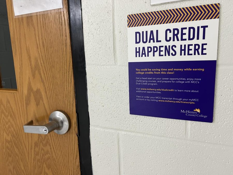 Signs+hang+outside+of+classrooms+where+dual+credit+classes+take+place+at+MCHS.+Next+year%2C+students+enrolled+in+dual+credit+classes+will+be+charged+%2425+per+class+each+semester.