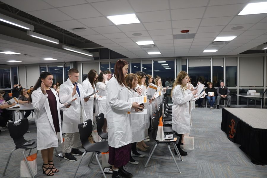 Biomedical students earn their white coats this may after completing four years on the biomedical pathway.