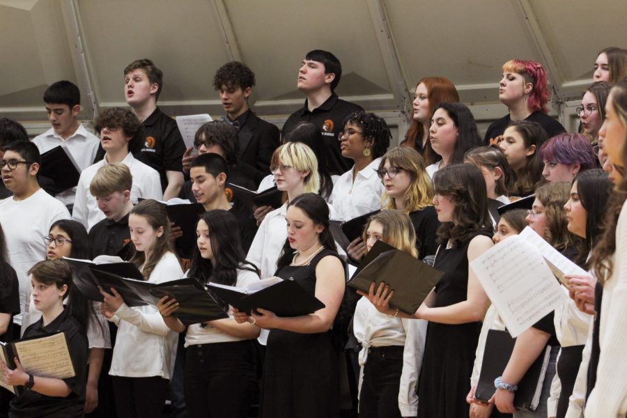 Students sing during the Winter Choir Concert in the Freshman Campus main gym on March 2. Several student groups performed, including all of MCHSs choirs, the schools guitar and the 8th grade choirs.