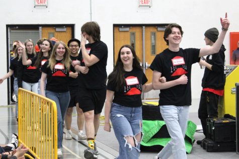 Mr. McHenry contestants walk with their chaperones during the spring spirit rally on March 23. The Mr. McHenry pageant will take place later that day in the Upper Campus auditorium.