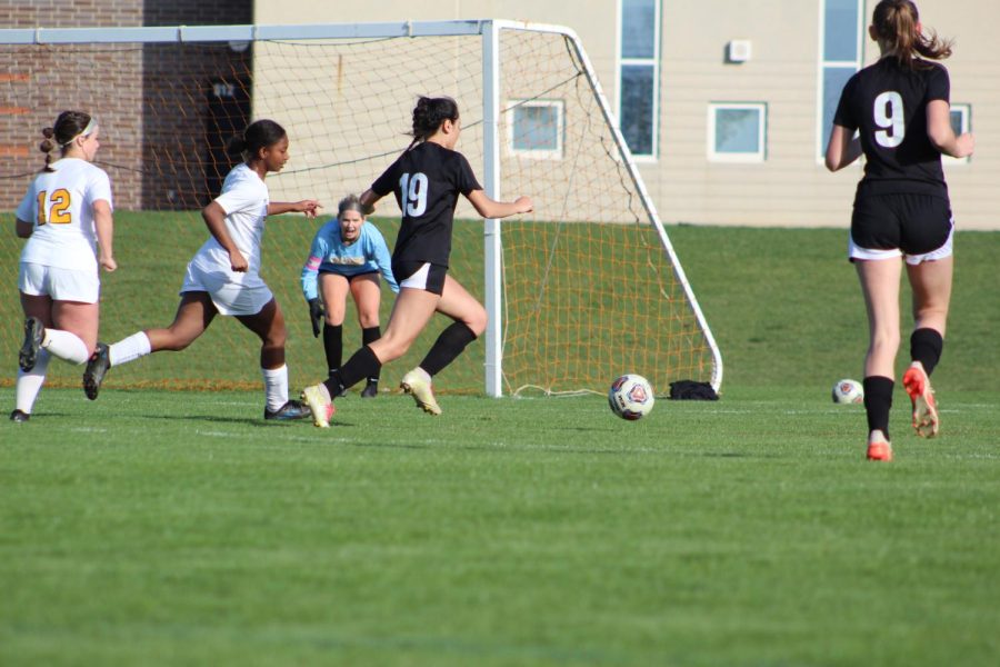 Jasmine Ortiz dribbles down the field during game against Harry D. Jacobs High School on Tuesday, April 19 at Upper Campus. 