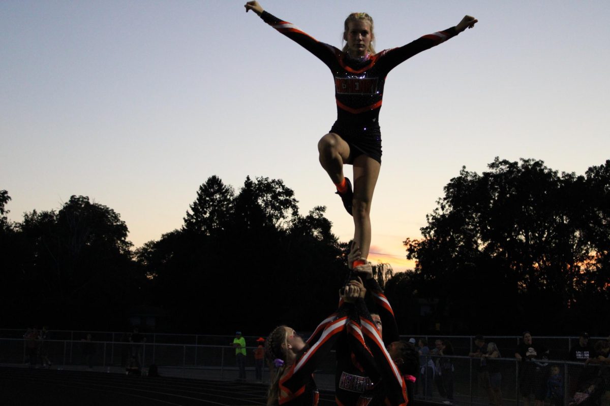 MCHS cheer team performs a stunt during the varsity football game against Huntley on Sept. 1 at McCracken Field.