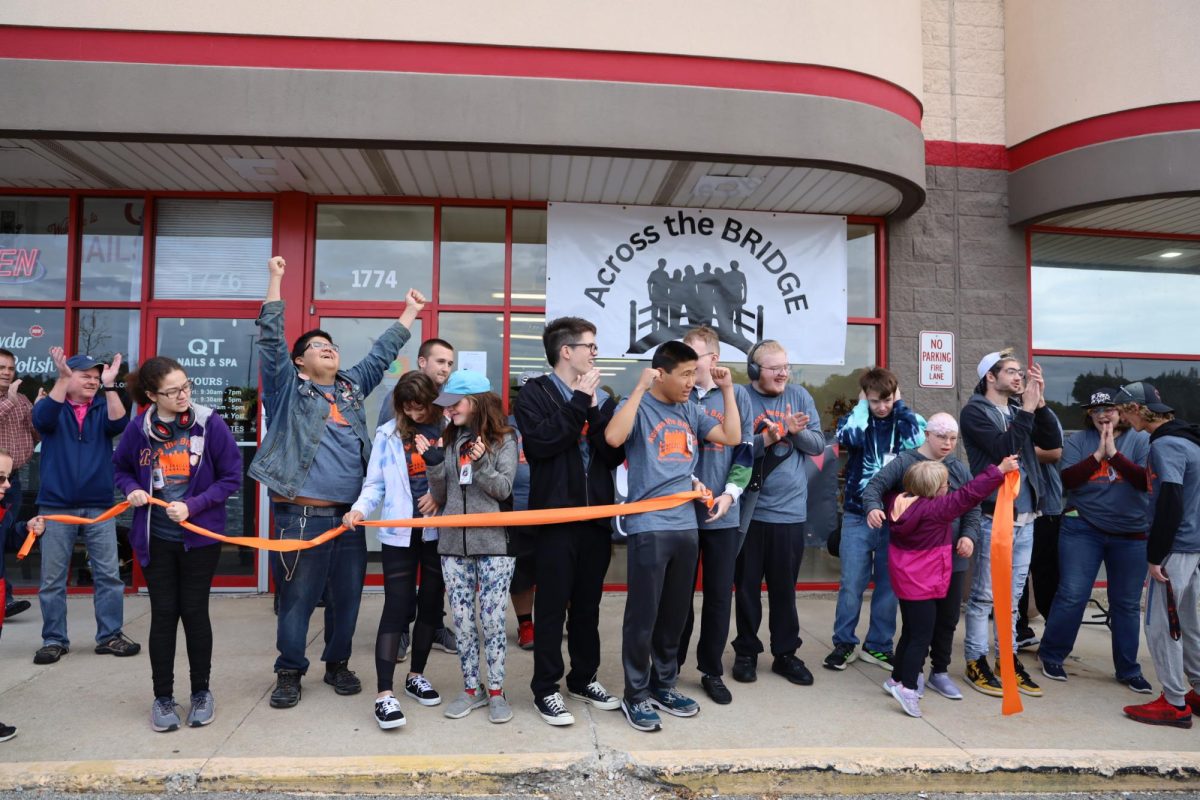Students+from+MCHSs+BRIDGES+program+cut+the+ribbon+of+Across+the+BRIDGE+on+Oct.+6+during+the+grand+opening+of+their+store+at+1774+N.+Richmond+Rd.+in+McHenry.