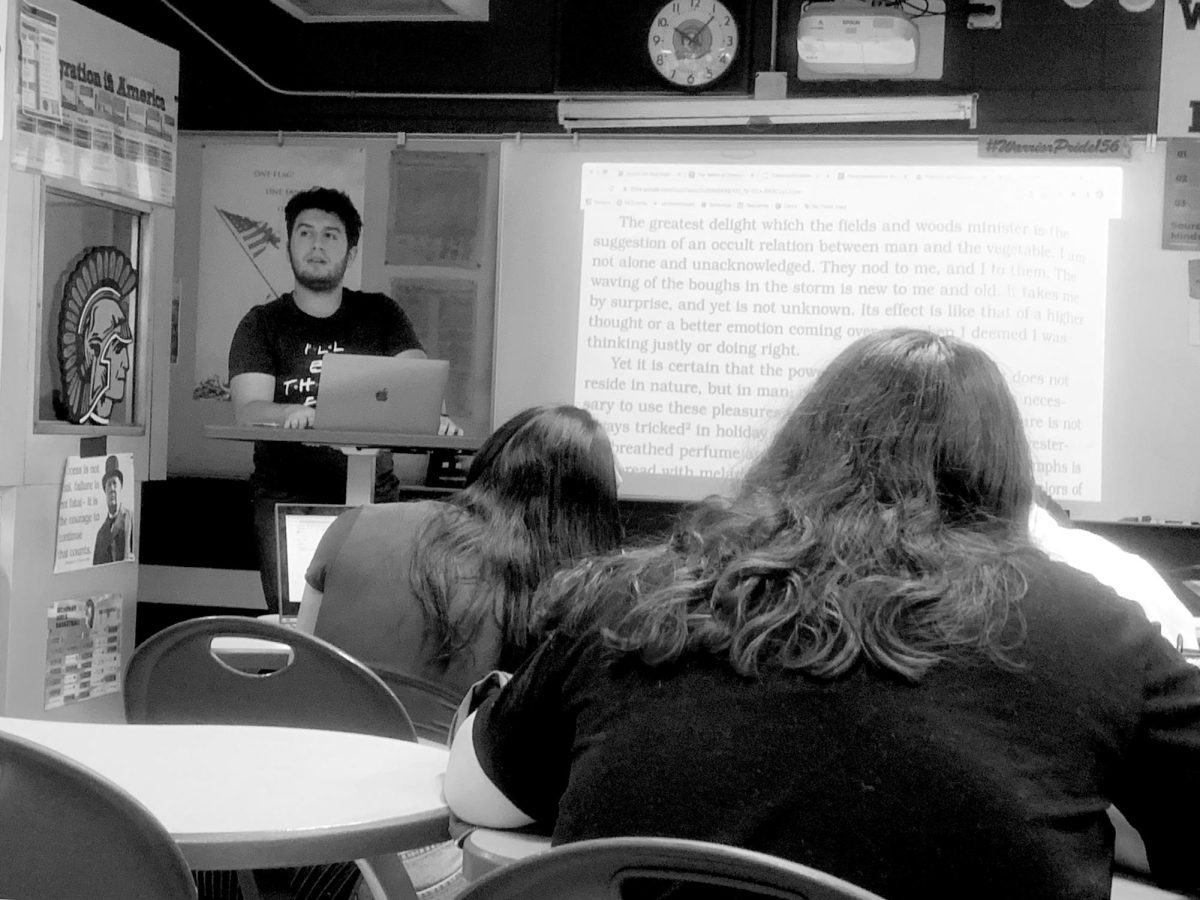 Student teacher Alex Maurer stands in front of his American Studies class on Oct. 4. Because of a budding relationship with Illinois State University, MCHS is attracting both student teachers and new teachers from the university.