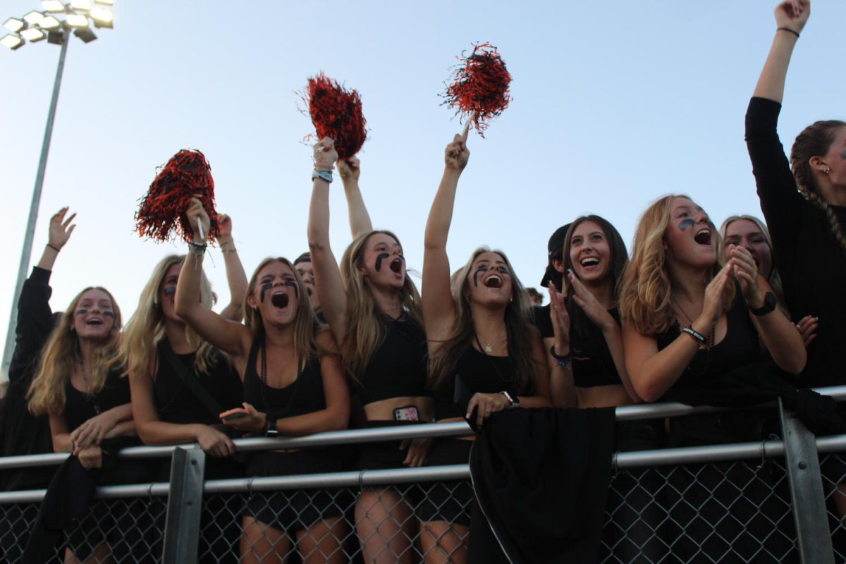 The crowd cheers during the first varsity football game of the season–the first ever at the revamped McCracken Field–on August 26, 2022.