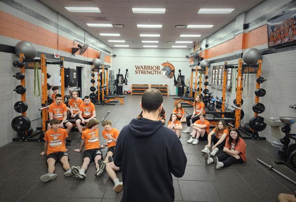 PE teacher Tony Swanson addresses his Strength class in the weight room at the Freshman Campus. His research shows that kids perform better in fitness testing when they engage in strength training.