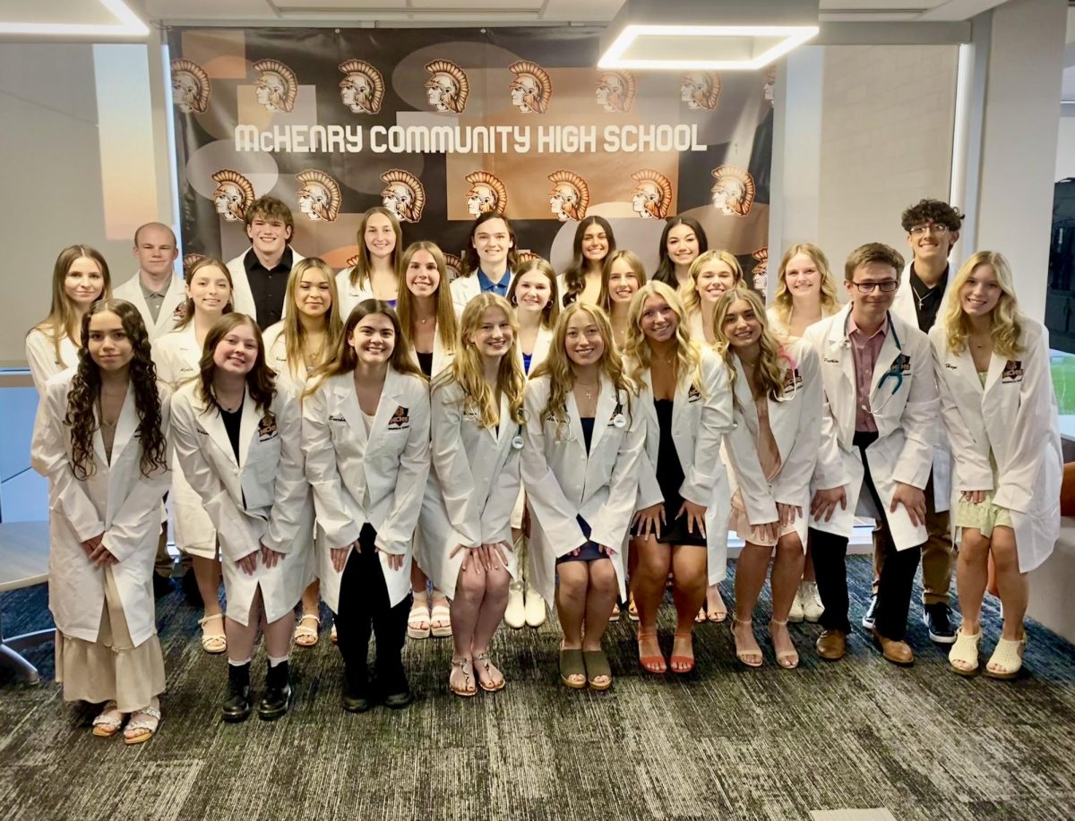 Students+in+MCHSs+Biomedical+program+pose+in+their+white+coats+during+a+special+celebration+on+April+15+at+the+Upper+Campus.