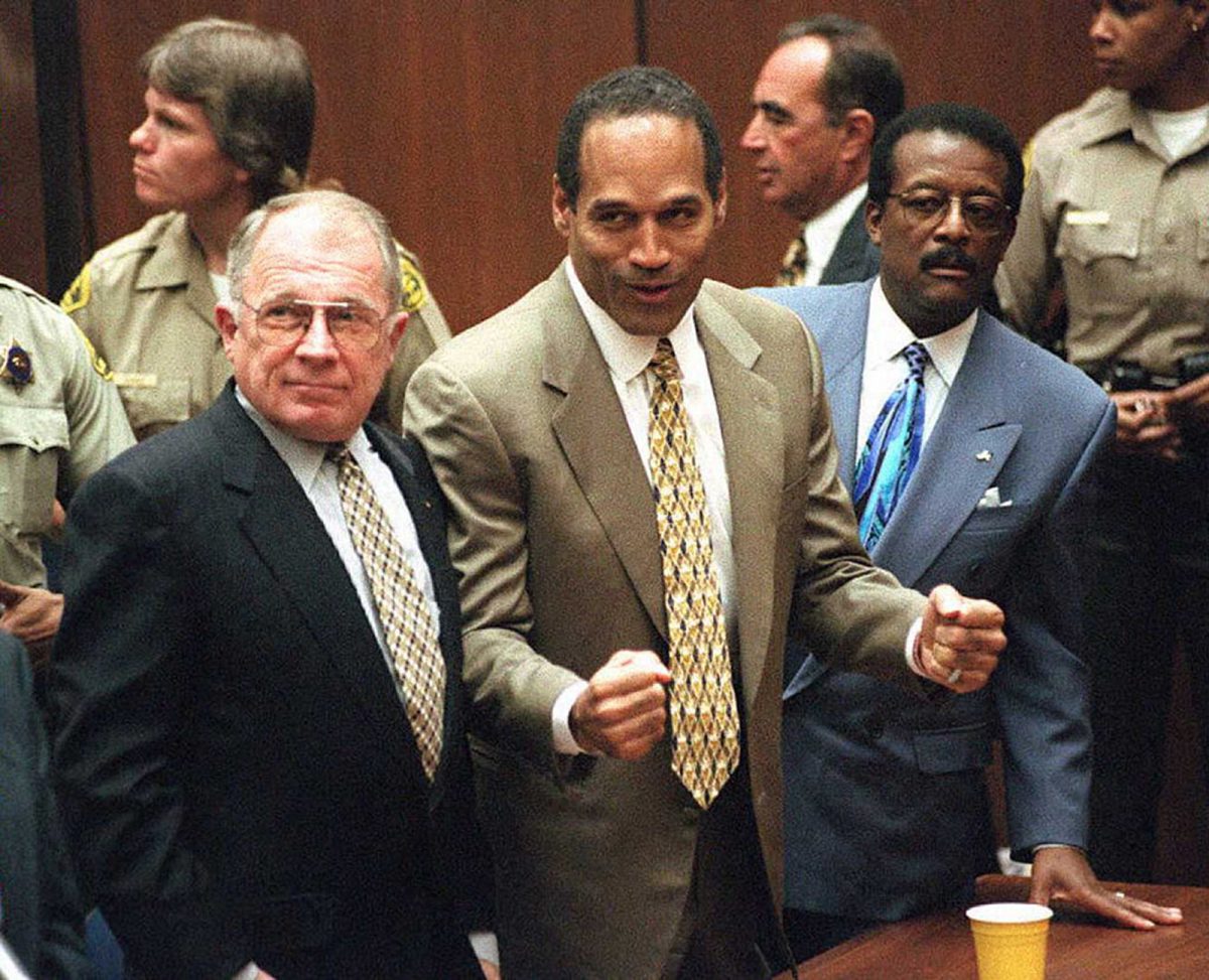 On Oct. 3, 1995, O.J. Simpson is found not guilty in the deaths of his ex-wife Nicole Brown Simpson and her friend Ron Goldman. Defense attorneys F. Lee Bailey, left, and Johnnie L. Cochran Jr. stand with him. 