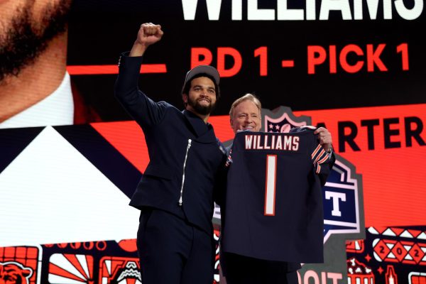 Caleb Williams, left, poses with NFL Commissioner Roger Goodell after being selected first overall by the Chicago Bears during the first round of the 2024 NFL Draft at Campus Martius Park and Hart Plaza on Thursday, April 25, 2024 in Detroit.