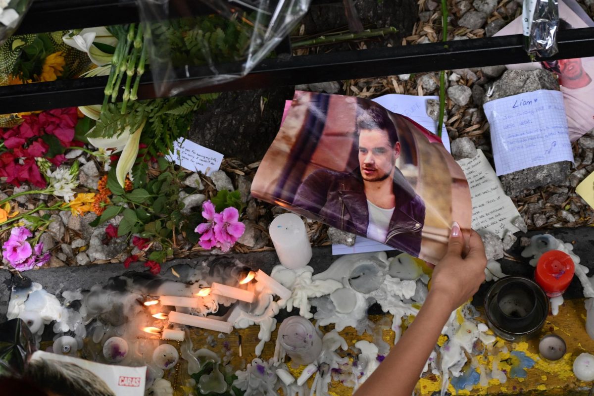 A fan pays tribute to British singer Liam Payne in front of the hotel where he died in Buenos Aires, Argentina, on Thursday, Oct. 17, 2024.